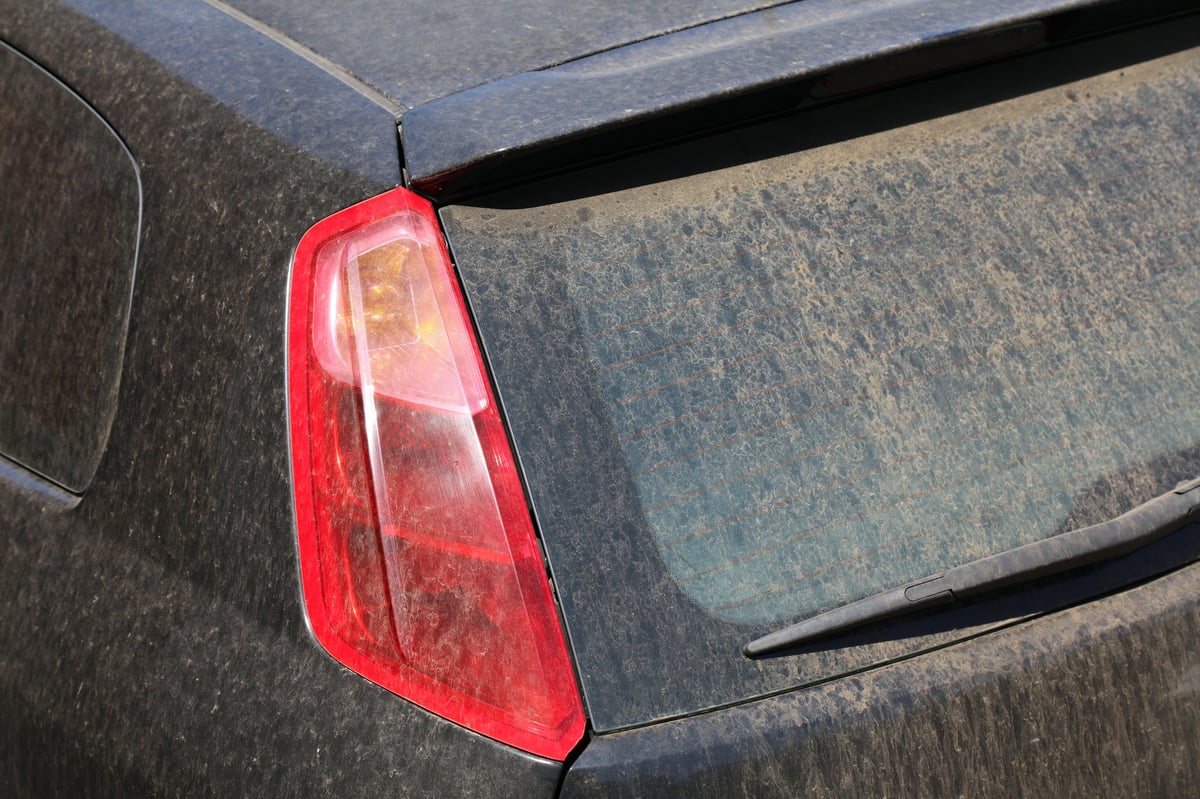 Dirty dusty car needing full detail treatment before professional cleaning