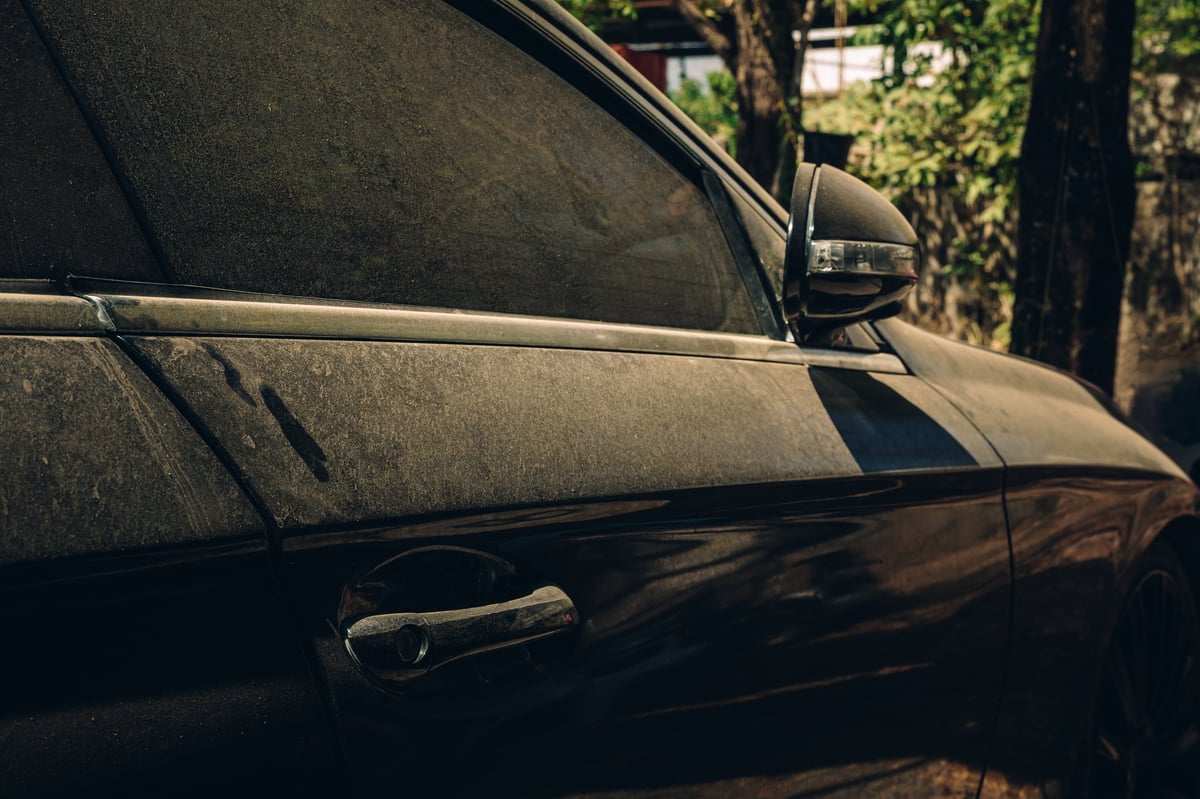 Beat up dusty Nissan Maxima before professional detailing and paint correction